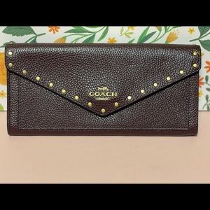 Coach soft oxblood envelope wallet with rivets